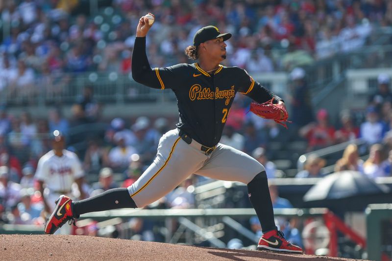 Sep 28, 2025; Cumberland, Georgia, USA; Pittsburgh Pirates pitcher Johan Oviedo (24) pitches the ball against the Atlanta Braves during the first inning at Truist Park. Mandatory Credit: Jordan Godfree-Imagn Images