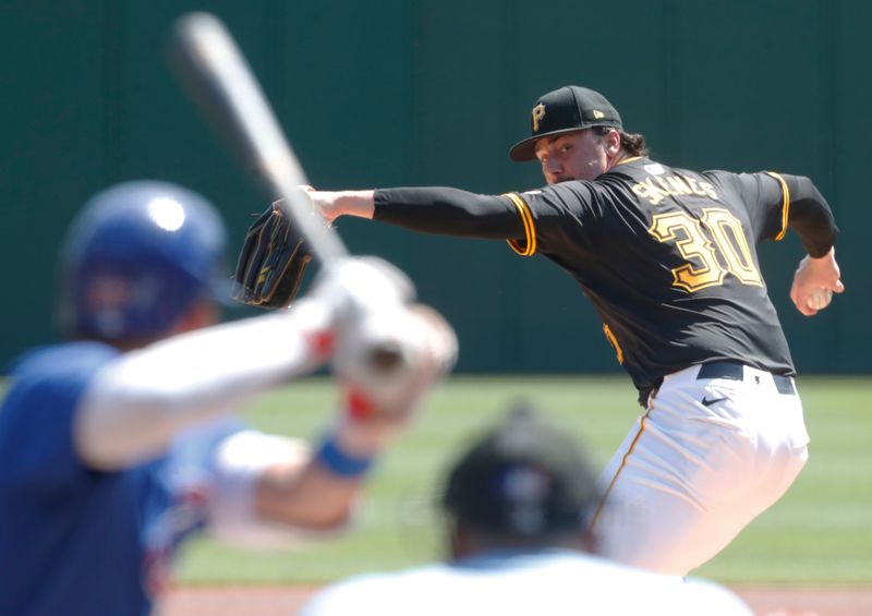 Aug 28, 2024; Pittsburgh, Pennsylvania, USA;  Pittsburgh Pirates starting pitcher Paul Skenes (30) delivers a pitch against Chicago Cubs third baseman Isaac Paredes (17) during the first inning at PNC Park. Mandatory Credit: Charles LeClaire-USA TODAY Sports