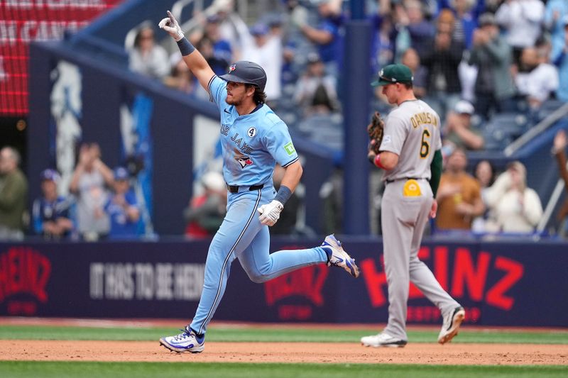 Jun 1, 2025; Toronto, Ontario, CAN; Toronto Blue Jays third baseman Addison Barger (47) celebrates as he runs the bases after hitting a three run home run against the Oakland Athletics during the eighth inning at Rogers Centre. Mandatory Credit: John E. Sokolowski-Imagn Images