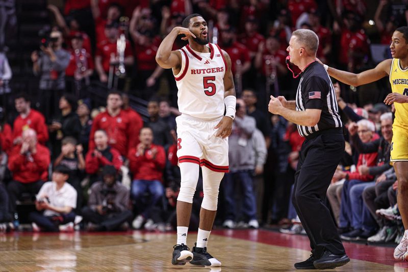 Feb 1, 2025; Piscataway, New Jersey, USA; Rutgers Scarlet Knights guard Tyson Acuff (5) reacts after making a three point basket during the first half against the Michigan Wolverines at Jersey Mike's Arena. Mandatory Credit: Vincent Carchietta-Imagn Images