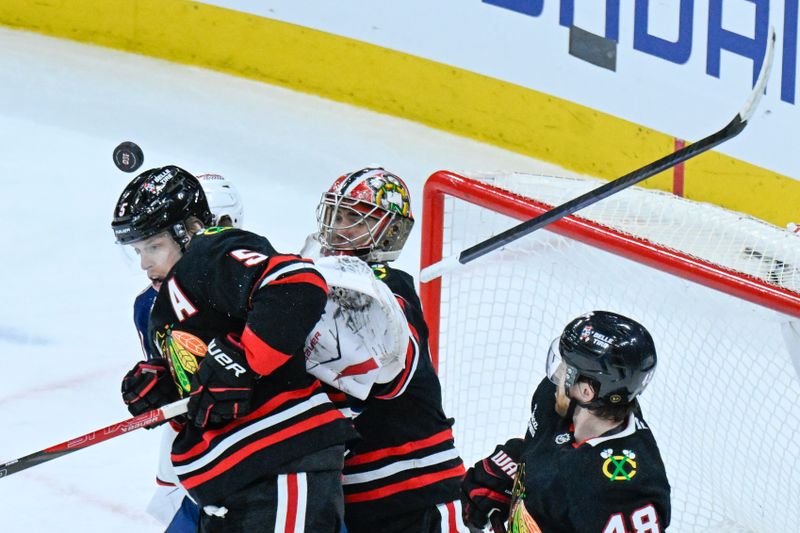 Jan 30, 2026; Chicago, Illinois, USA;  Chicago Blackhawks defenseman Connor Murphy (5) and Columbus Blue Jackets goaltender Elvis Merzlikins (90) watch a loose puck during the third period at the United Center. Mandatory Credit: Matt Marton-Imagn Images