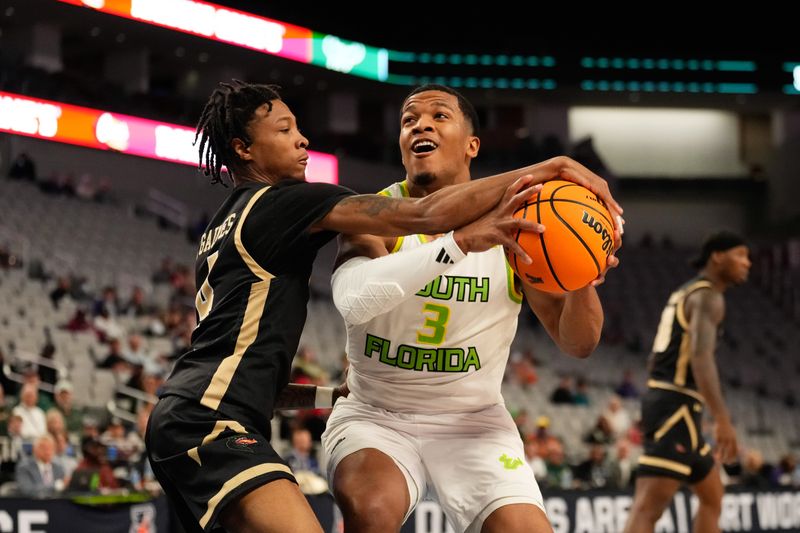 Mar 16, 2024; Fort Worth, TX, USA;  South Florida Bulls guard Chris Youngblood (3) drives to the basket and is fouled by UAB Blazers guard Eric Gaines (4) during the first half at Dickies Arena. Mandatory Credit: Chris Jones-USA TODAY Sports