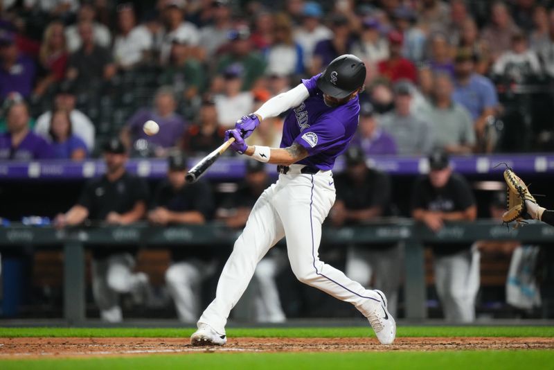 Jul 19, 2024; Denver, Colorado, USA; Colorado Rockies outfielder Jake Cave (11) hits a three run home run in the eighth inning against the San Francisco Giants at Coors Field. Mandatory Credit: Ron Chenoy-USA TODAY Sports