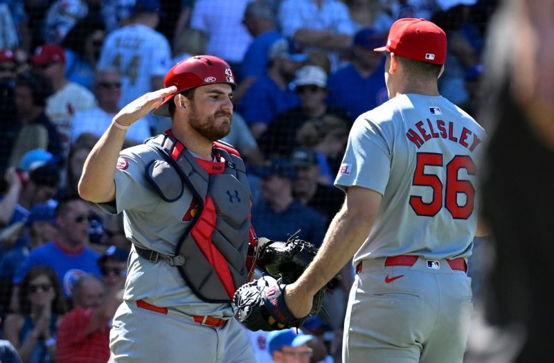 Jun 14, 2024; Chicago, Illinois, USA;  St. Louis Cardinals catcher Pedro PagÈs (43) and  pitcher Ryan Helsley (56) high five after the game against the Chicago Cubs at Wrigley Field. Mandatory Credit: Matt Marton-USA TODAY Sports