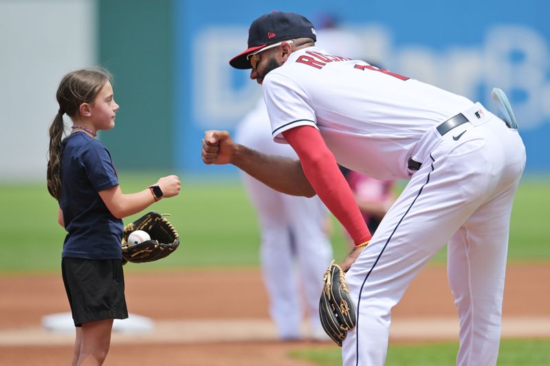 Jun 25, 2023; Cleveland, Ohio, USA; Cleveland Guardians shortstop Amed Rosario (1) greets a young fan before the game. between the Guardians and the Milwaukee Brewers at Progressive Field. Mandatory Credit: Ken Blaze-USA TODAY Sports