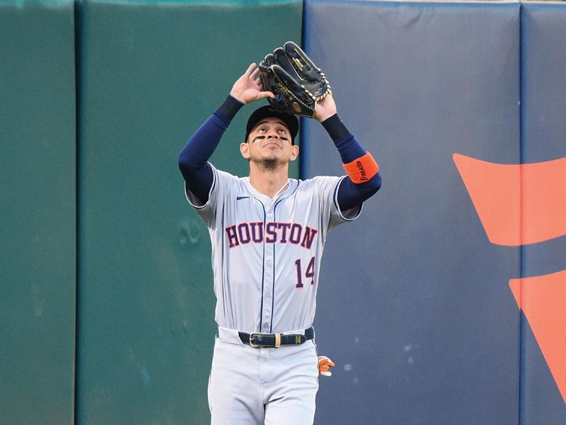 Jul 22, 2024; Oakland, California, USA; Houston Astros left fielder Mauricio Dubon (14) catches the ball against the Oakland Athletics during the second inning at Oakland-Alameda County Coliseum. Mandatory Credit: Kelley L Cox-USA TODAY Sports