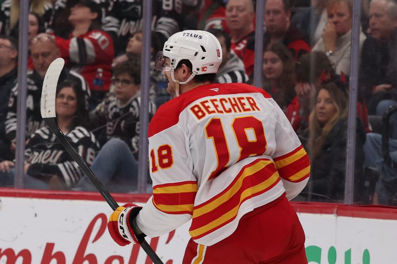 Mar 12, 2026; Newark, New Jersey, USA; Calgary Flames center John Beecher (18) celebrates his goal against the New Jersey Devils during the first period at Prudential Center. Mandatory Credit: Ed Mulholland-Imagn Images