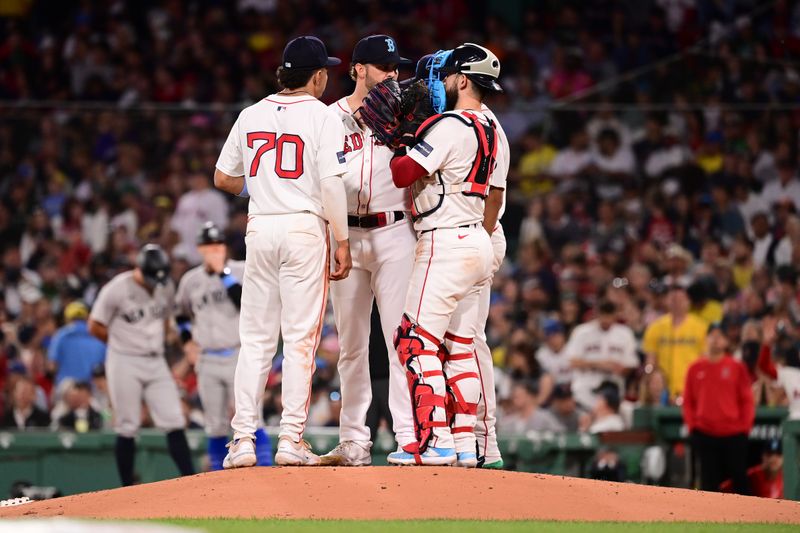 Jun 16, 2024; Boston, Massachusetts, USA; Boston Red Sox starting pitcher Kutter Crawford (50) has a meeting on the mound with catcher Connor Wong (12) and shortstop David Hamilton (70) during the sixth inning against the New York Yankees at Fenway Park. Mandatory Credit: Eric Canha-USA TODAY Sports