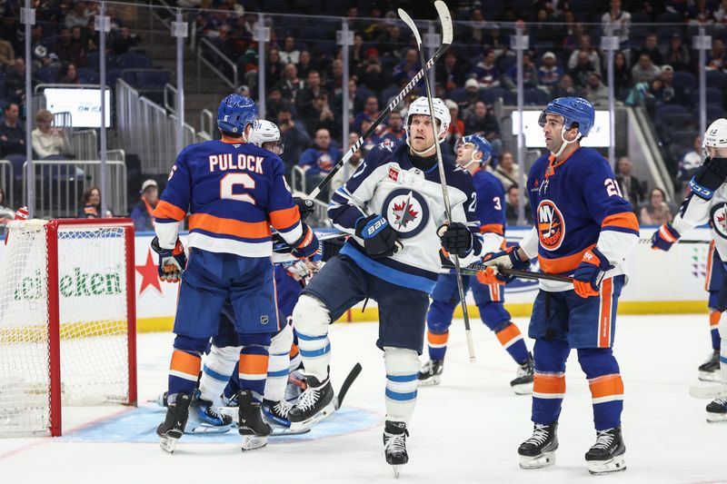 Mar 4, 2025; Elmont, New York, USA;  Winnipeg Jets left wing Nikolaj Ehlers (27) celebrates after scoring a goal in the third period against the New York Islanders at UBS Arena. Mandatory Credit: Wendell Cruz-Imagn Images