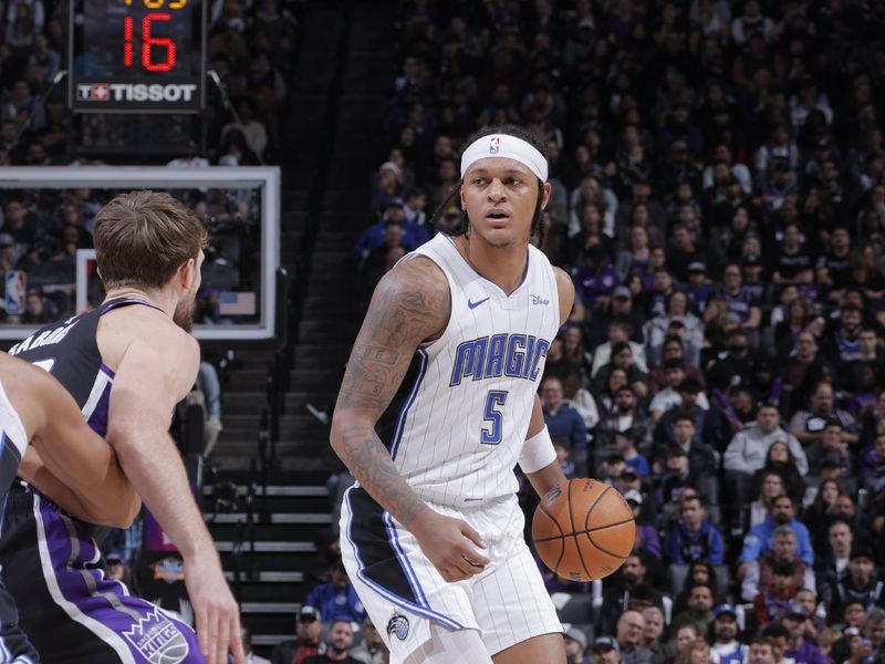 SACRAMENTO, CA - JANUARY 3: Paolo Banchero #5 of the Orlando Magic dribbles the ball during the game against the Sacramento Kings on January 3, 2024 at Golden 1 Center in Sacramento, California. NOTE TO USER: User expressly acknowledges and agrees that, by downloading and or using this Photograph, user is consenting to the terms and conditions of the Getty Images License Agreement. Mandatory Copyright Notice: Copyright 2024 NBAE (Photo by Rocky Widner/NBAE via Getty Images)