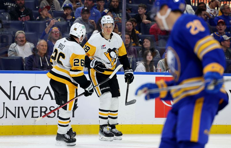 Sep 21, 2024; Buffalo, New York, USA;  Pittsburgh Penguins right wing Jesse Puljujarvi (18) reacts after scoring his third goal of the game during the third period against the Buffalo Sabres at KeyBank Center. Mandatory Credit: Timothy T. Ludwig-Imagn Images