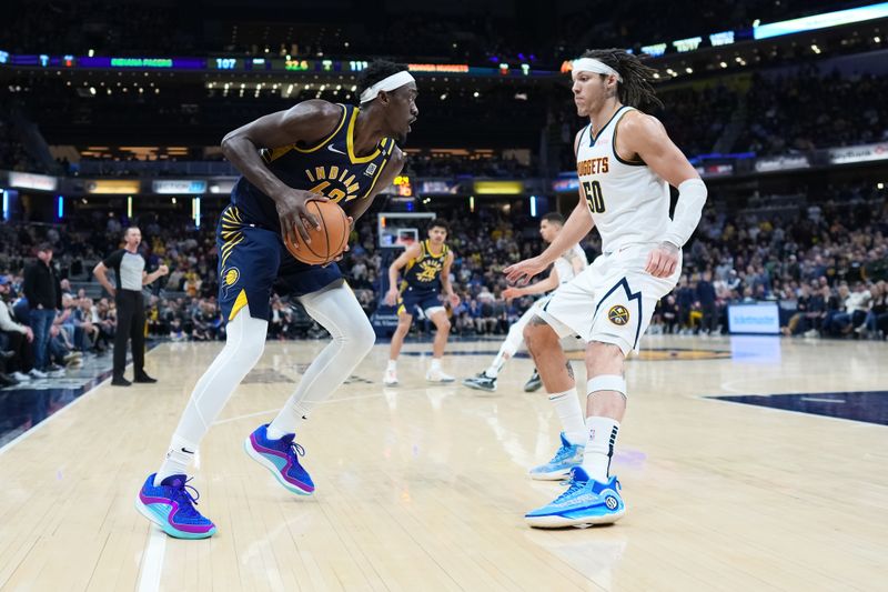 INDIANAPOLIS, INDIANA - JANUARY 23: Pascal Siakam #43 of the Indiana Pacers handles the ball while being guarded by Aaron Gordon #50 of the Denver Nuggets in the fourth quarter at Gainbridge Fieldhouse on January 23, 2024 in Indianapolis, Indiana. NOTE TO USER: User expressly acknowledges and agrees that, by downloading and or using this photograph, User is consenting to the terms and conditions of the Getty Images License Agreement. (Photo by Dylan Buell/Getty Images)