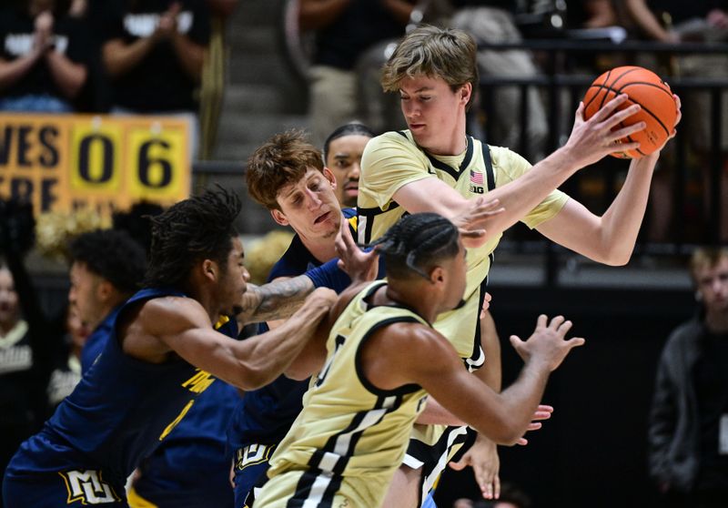 Dec 13, 2025; West Lafayette, Indiana, USA; Purdue Boilermakers guard Jack Benter (14) fights to keep the ball during the first half against the Marquette Golden Eagles at Mackey Arena. Mandatory Credit: Marc Lebryk-Imagn Images