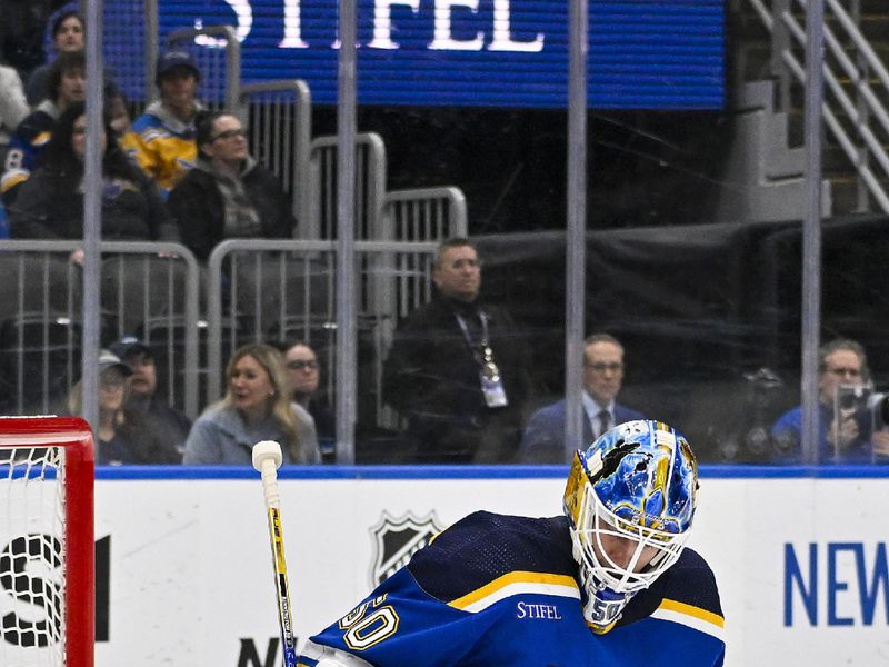 Feb 22, 2024; St. Louis, Missouri, USA;  St. Louis Blues goaltender Jordan Binnington (50) defends the net against the New York Islanders during the first period at Enterprise Center. Mandatory Credit: Jeff Curry-USA TODAY Sports