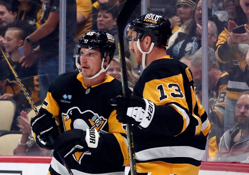 Oct 4, 2024; Pittsburgh, Pennsylvania, USA;  Pittsburgh Penguins center Noel Acciari (55) celebrates his goal with right wing Kevin Hayes (13) against the Columbus Blue Jackets during the first period at PPG Paints Arena. Mandatory Credit: Charles LeClaire-Imagn Images