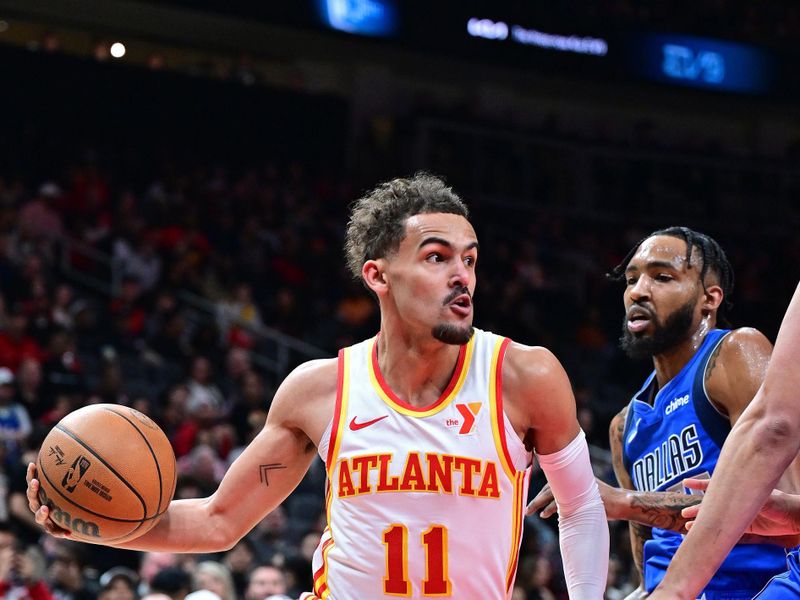 ATLANTA, GA - JANUARY 26: Trae Young #11 of the Atlanta Hawks handles the ball during the game against the Dallas Mavericks on January 26, 2024 at State Farm Arena in Atlanta, Georgia.  NOTE TO USER: User expressly acknowledges and agrees that, by downloading and/or using this Photograph, user is consenting to the terms and conditions of the Getty Images License Agreement. Mandatory Copyright Notice: Copyright 2024 NBAE (Photo by Adam Hagy/NBAE via Getty Images)