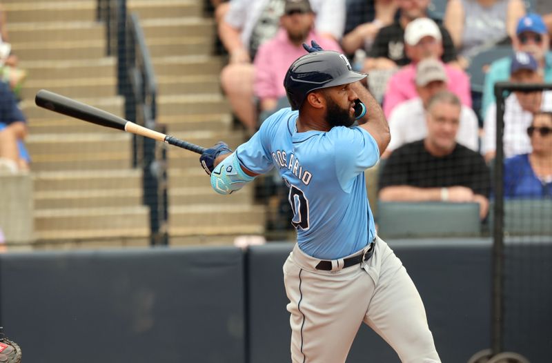 Mar 6, 2024; Tampa, Florida, USA;  Tampa Bay Rays shortstop Amed Rosario (10) doubles during the fourth inning against the New York Yankees at George M. Steinbrenner Field. Mandatory Credit: Kim Klement Neitzel-USA TODAY Sports