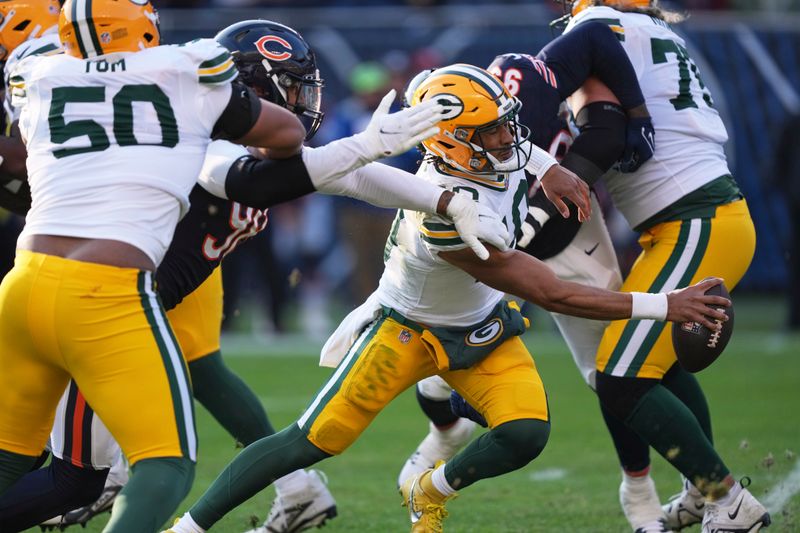 Chicago Bears' Montez Sweat stops Green Bay Packers' Jordan Love on a fourth down run during the second half of an NFL football game Sunday, Nov. 17, 2024, in Chicago. (AP Photo/Charles Rex Arbogast)