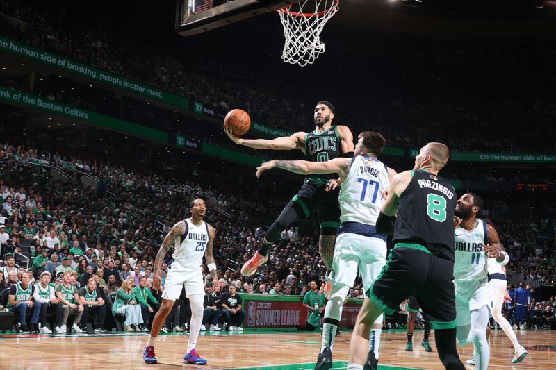 BOSTON, MA - JUNE 9: Jayson Tatum #0 of the Boston Celtics drives to the basket during the game against the Dallas Mavericks during Game 1 of the 2024 NBA Finals on June 9, 2024 at the TD Garden in Boston, Massachusetts. NOTE TO USER: User expressly acknowledges and agrees that, by downloading and or using this photograph, User is consenting to the terms and conditions of the Getty Images License Agreement. Mandatory Copyright Notice: Copyright 2024 NBAE  (Photo by Nathaniel S. Butler/NBAE via Getty Images)