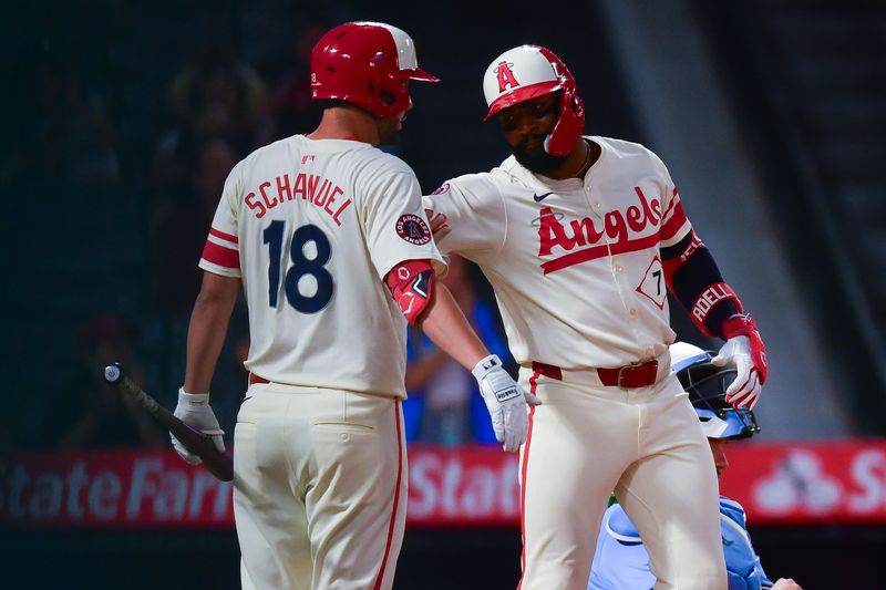 Aug 12, 2024; Anaheim, California, USA; Los Angeles Angels right fielder Jo Adell (7) is greeted by first baseman Nolan Schanuel (18) after hitting a solo home run against the Toronto Blue Jays during the ninth inning at Angel Stadium. Mandatory Credit: Gary A. Vasquez-USA TODAY Sports