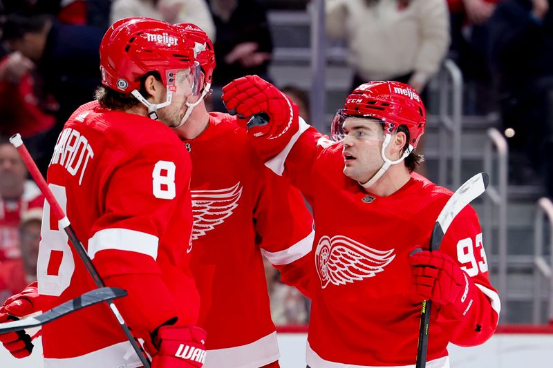 Nov 11, 2023; Detroit, Michigan, USA;  Detroit Red Wings right wing Alex DeBrincat (93) celebrates with teammates after scoring against the Columbus Blue Jackets in the second period at Little Caesars Arena. Mandatory Credit: Rick Osentoski-USA TODAY Sports