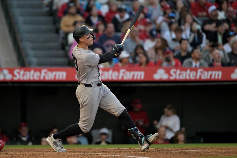 May 30, 2024; Anaheim, California, USA;  New York Yankees center fielder Aaron Judge (99) hits a two-run home run scoring right fielder Juan Soto (22) in the fourth inning against the Los Angeles Angels at Angel Stadium. Mandatory Credit: Jayne Kamin-Oncea-USA TODAY Sports