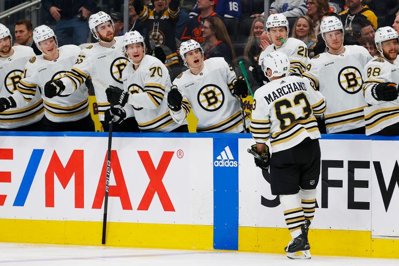 Feb 21, 2024; Edmonton, Alberta, CAN; The Boston Bruins celebrate a goal scored by  forward Brad Marchand (63) during the second period against the Edmonton Oilers at Rogers Place. Mandatory Credit: Perry Nelson-USA TODAY Sports