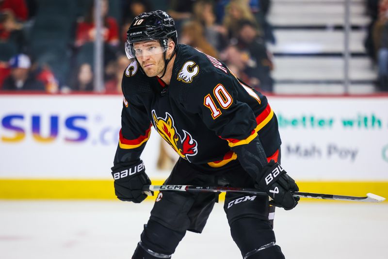 Mar 12, 2024; Calgary, Alberta, CAN; Calgary Flames center Jonathan Huberdeau (10) during the face off against the Colorado Avalanche during the second period at Scotiabank Saddledome. Mandatory Credit: Sergei Belski-USA TODAY Sports