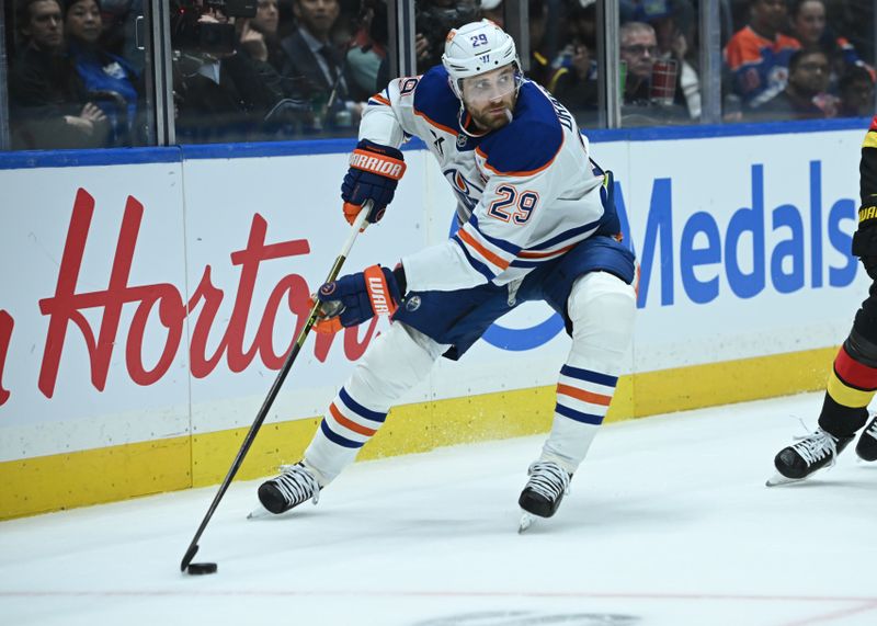 Oct 26, 2025; Vancouver, British Columbia, CAN; Edmonton Oilers center Leon Draisaitl (29) skates with the puck against Vancouver Canucks during the first period at Rogers Arena. Mandatory Credit: Simon Fearn-Imagn Images