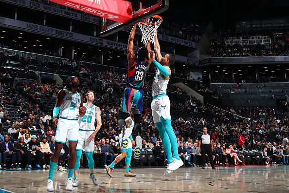 BROOKLYN, NY - NOVEMBER 30: Nicolas Claxton #33 of the Brooklyn Nets dunks the ball during the game against the Charlotte Hornets on November 30, 2023 at Barclays Center in Brooklyn, New York. NOTE TO USER: User expressly acknowledges and agrees that, by downloading and or using this Photograph, user is consenting to the terms and conditions of the Getty Images License Agreement. Mandatory Copyright Notice: Copyright 2023 NBAE (Photo by David L. Nemec/NBAE via Getty Images)