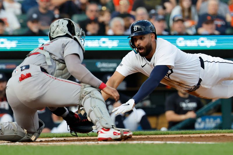 May 14, 2025; Detroit, Michigan, USA;  Detroit Tigers outfielder Riley Greene (31) dives in safe at home ahead of the tag by Boston Red Sox catcher Carlos Narváez (75) in the second inning at Comerica Park. Mandatory Credit: Rick Osentoski-Imagn Images