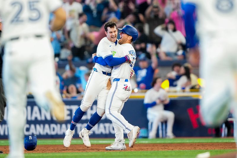 May 17, 2025; Toronto, Ontario, CAN; Toronto Blue Jays third base Ernie Clement (22) celebrates after hitting a walk off single to defeat the Detroit Tigers during the ninth inning in their MLB game at Rogers Centre. Mandatory Credit: Kevin Sousa-Imagn Images