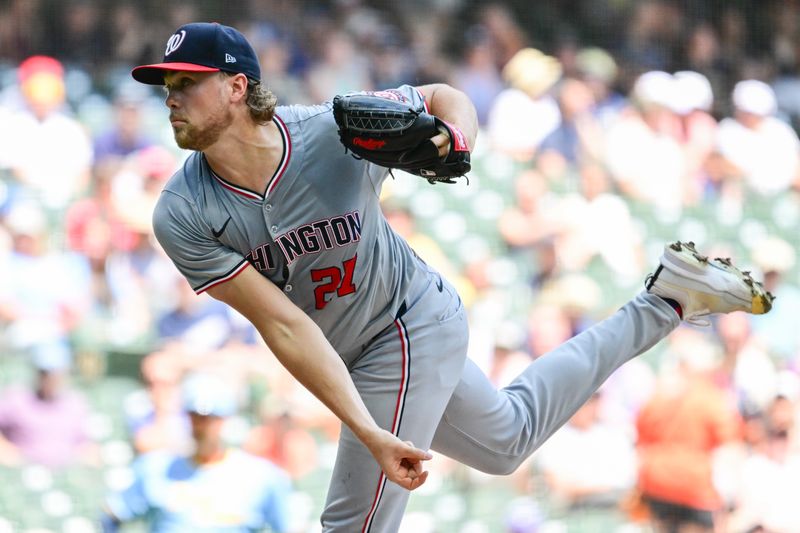 Jul 14, 2024; Milwaukee, Wisconsin, USA; Washington Nationals starting pitcher Jake Irvin (27) throws in the first inning against the Milwaukee Brewers at American Family Field. Mandatory Credit: Benny Sieu-USA TODAY Sports