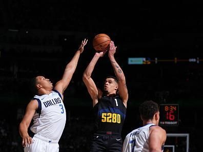 DENVER, CO - DECEMBER 18: Michael Porter Jr. #1 of the Denver Nuggets shoots the ball during the game against the Dallas Mavericks on December 18, 2023 at the Ball Arena in Denver, Colorado. NOTE TO USER: User expressly acknowledges and agrees that, by downloading and/or using this Photograph, user is consenting to the terms and conditions of the Getty Images License Agreement. Mandatory Copyright Notice: Copyright 2023 NBAE (Photo by Garrett Ellwood/NBAE via Getty Images)