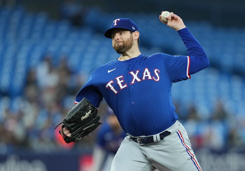 Sep 13, 2023; Toronto, Ontario, CAN; Texas Rangers starting pitcher Jordan Montgomery (52) throws a pitch against the Toronto Blue Jays during the first inning at Rogers Centre. Mandatory Credit: Nick Turchiaro-USA TODAY Sports