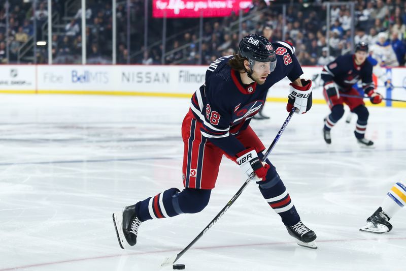 Jan 26, 2023; Winnipeg, Manitoba, CAN;  Winnipeg Jets forward Kevin Stenlund (28) shoots on the Buffalo Sabres net during the second period at Canada Life Centre. Mandatory Credit: Terrence Lee-USA TODAY Sports