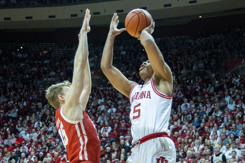 Jan 14, 2023; Bloomington, Indiana, USA; Indiana Hoosiers forward Malik Reneau (5) shoots the ball while Wisconsin Badgers forward Markus Ilver (35) defends in the first half at Simon Skjodt Assembly Hall. Mandatory Credit: Trevor Ruszkowski-USA TODAY Sports