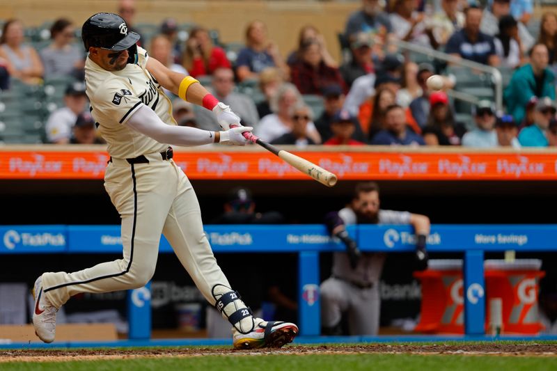 Jun 12, 2024; Minneapolis, Minnesota, USA; Minnesota Twins designated hitter Royce Lewis (23) hits a two-run home run against the Colorado Rockies in the sixth inning at Target Field. Mandatory Credit: Bruce Kluckhohn-USA TODAY Sports