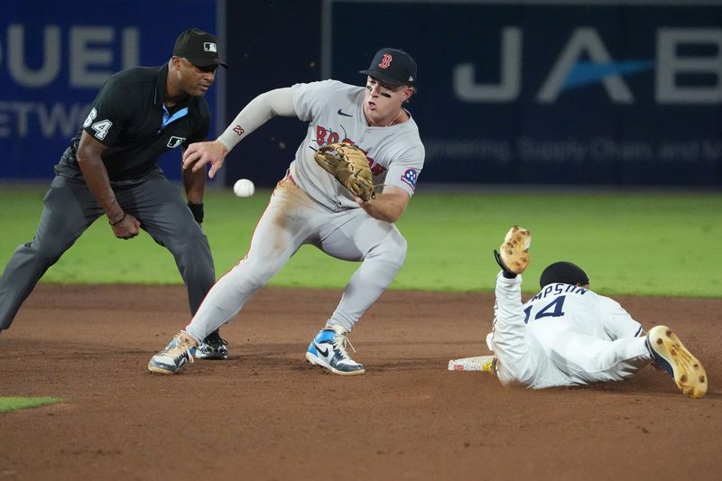 Sep 21, 2025; Tampa, Florida, USA; Tampa Bay Rays outfielder Chandler Simpson (14) steals second as Boston Red Sox shortstop Trevor Story (10) tries to make the tag during the fifth inning at George M. Steinbrenner Field. Mandatory Credit: Dave Nelson-Imagn Images
