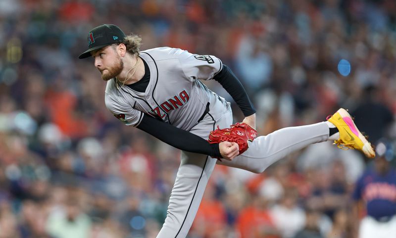 Sep 8, 2024; Houston, Texas, USA; Arizona Diamondbacks starting pitcher Ryne Nelson (19) delivers a pitch during the first inning against the Houston Astros at Minute Maid Park. Mandatory Credit: Troy Taormina-Imagn Images