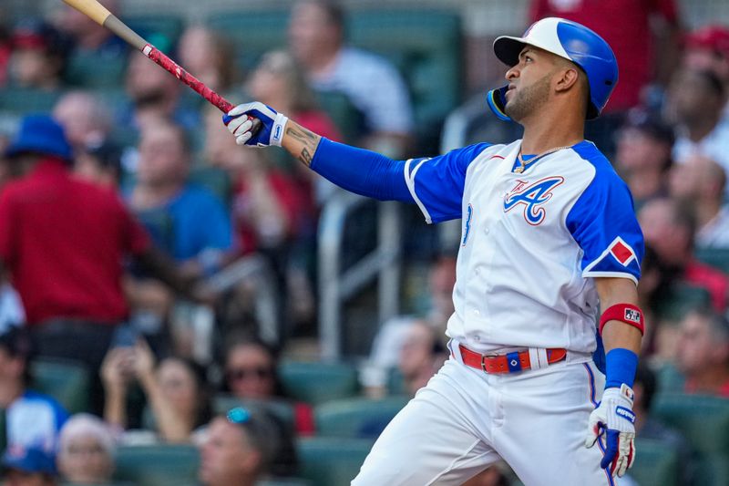 Jul 29, 2023; Cumberland, Georgia, USA; Atlanta Braves left fielder Eddie Rosario (8) watches after hitting a two run home run against the Milwaukee Brewers during the first inning at Truist Park. Mandatory Credit: Dale Zanine-USA TODAY Sports