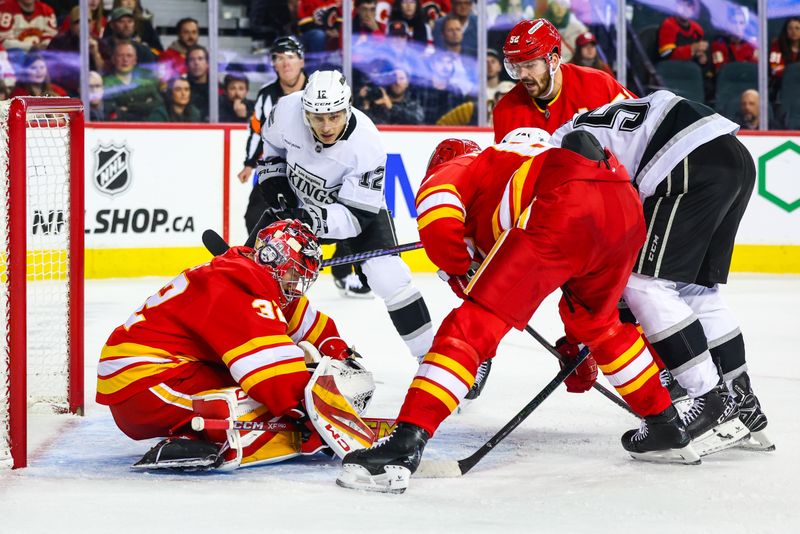 Nov 11, 2024; Calgary, Alberta, CAN; Calgary Flames goaltender Dustin Wolf (32) makes a save against the Los Angeles Kings during the third period at Scotiabank Saddledome. Mandatory Credit: Sergei Belski-Imagn Images