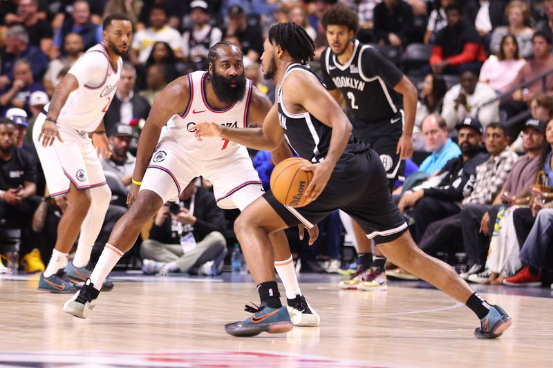 OCEANSIDE, CALIFORNIA - OCTOBER 08: James Harden #1 of the Los Angeles Clippers defends against Cam Thomas #24 of the Brooklyn Nets in the second quarter of the preseason game at Frontwave Arena on October 08, 2024 in Oceanside, California. NOTE TO USER: User expressly acknowledges and agrees that, by downloading and or using this photograph, User is consenting to the terms and conditions of the Getty Images License Agreement. (Photo by Joe Scarnici/Getty Images)