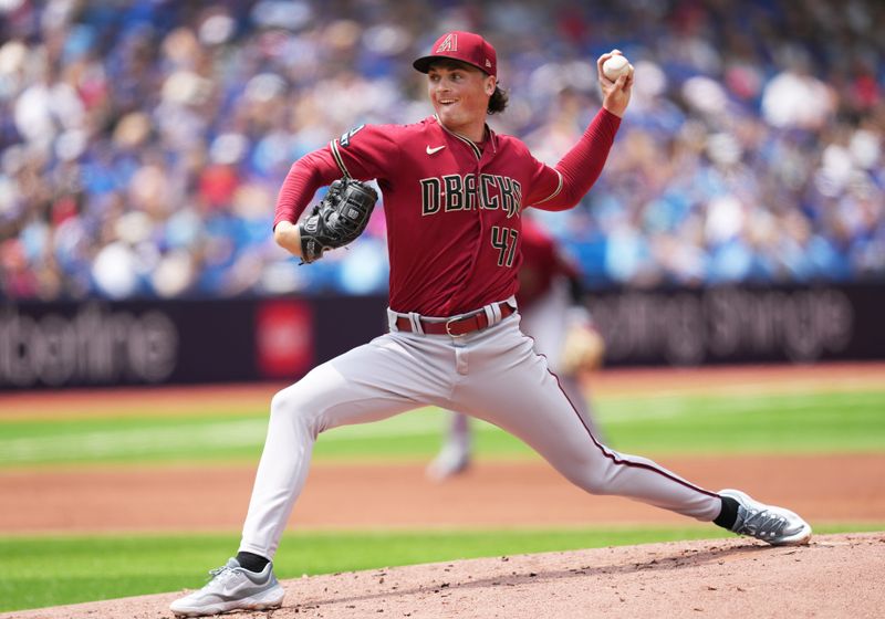 Jul 16, 2023; Toronto, Ontario, CAN; Arizona Diamondbacks starting pitcher Tommy Henry (47) throws pitch against the Toronto Blue Jays during the first inning at Rogers Centre. Mandatory Credit: Nick Turchiaro-USA TODAY Sports