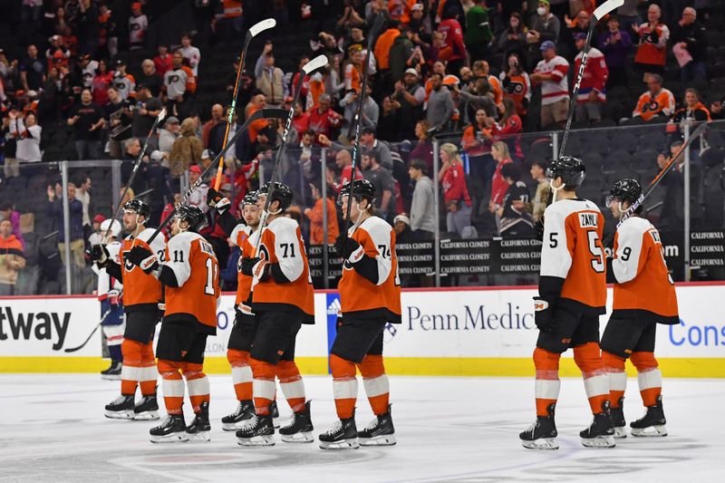 Apr 16, 2024; Philadelphia, Pennsylvania, USA; Philadelphia Flyers right wing Travis Konecny (11), right wing Tyson Foerster (71) and right wing Owen Tippett (74) acknowledge the fans after loss to the Washington Capitals during the second period at Wells Fargo Center. Mandatory Credit: Eric Hartline-USA TODAY Sports