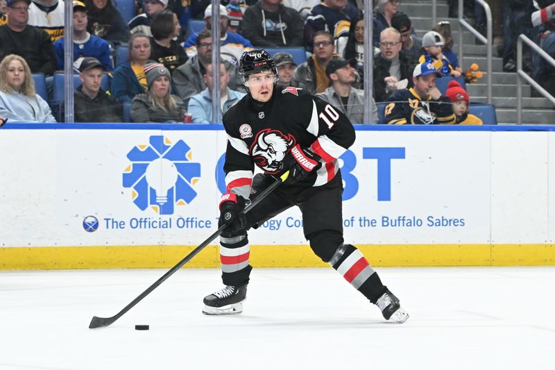 Jan 31, 2025; Buffalo, New York, USA; Buffalo Sabres defenseman Henri Jokiharju (10) skates with the puck in the first period in a game against the Nashville Predators at the KeyBank Center. Mandatory Credit: Mark Konezny-Imagn Images