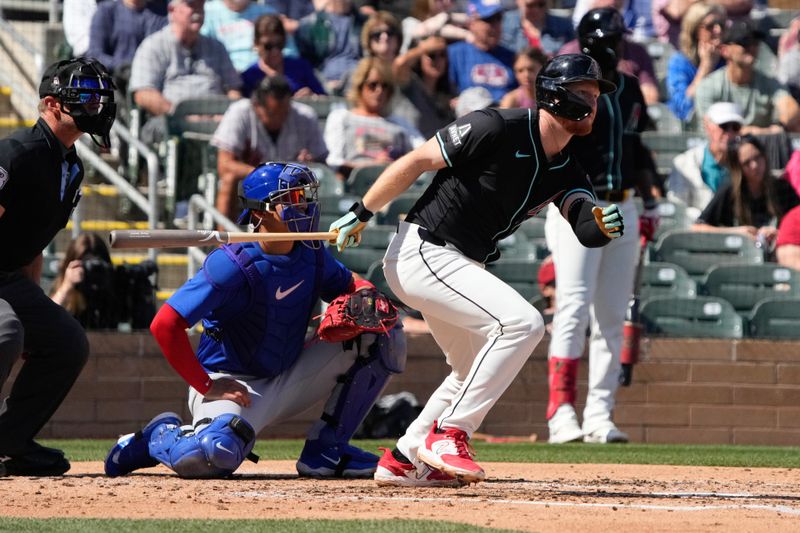 Mar 8, 2024; Salt River Pima-Maricopa, Arizona, USA; Arizona Diamondbacks outfielder Pavin Smith (26) hits a single against the Chicago Cubs in the second inning at Salt River Fields at Talking Stick. Mandatory Credit: Rick Scuteri-USA TODAY Sports