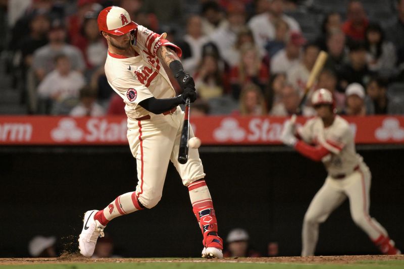 Sep 16, 2024; Anaheim, California, USA;  Los Angeles Angels second baseman Charles Leblanc (33) hits a solo home run in the fifth inning against the Chicago White Sox at Angel Stadium. Mandatory Credit: Jayne Kamin-Oncea-Imagn Images