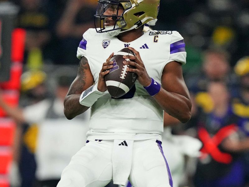 Jan 8, 2024; Houston, TX, USA; Washington Huskies quarterback Michael Penix Jr. (9) drops back to throws a pass during the second quarter against the Michigan Wolverines in the 2024 College Football Playoff national championship game at NRG Stadium. Mandatory Credit: Kirby Lee-USA TODAY Sports