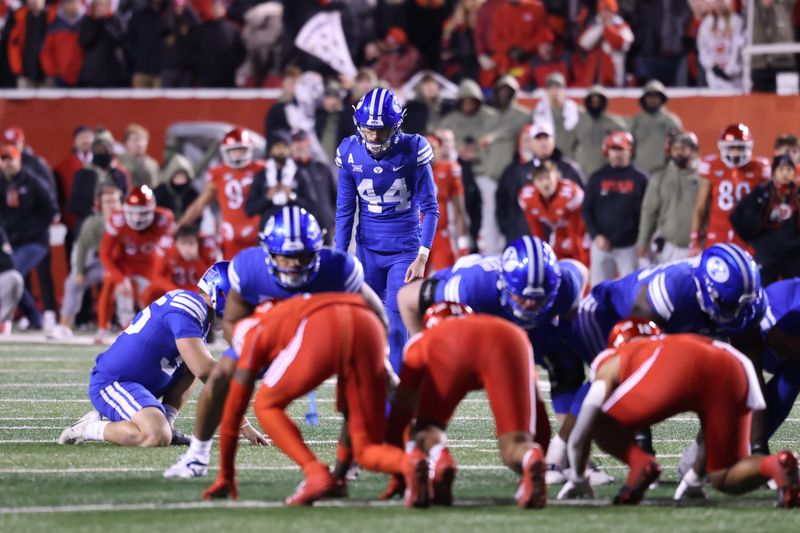 Nov 9, 2024; Salt Lake City, Utah, USA; Brigham Young Cougars place kicker Will Ferrin (44) kicks a field goal to take the lead over the Utah Utes during the last seconds of the game at Rice-Eccles Stadium. Mandatory Credit: Rob Gray-Imagn Images